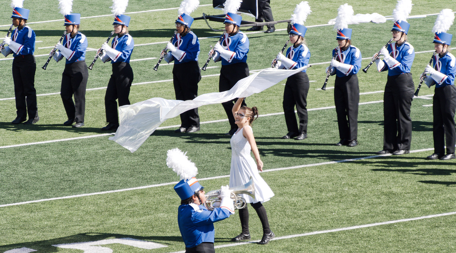 Whitnee Weiher performs a flag solo during Quitman's performance at the UIL Region 4 marching band competition in Texarkana on Tuesday.